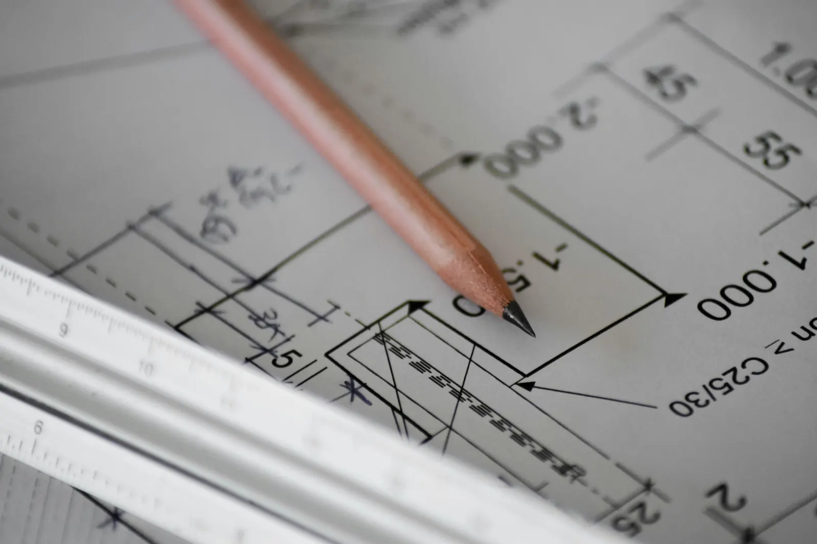 Architectural blueprint with pencil and ruler